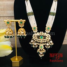 Shaira Long Pacchi Kundan Emerald Statement Necklace/ Rajwadi Ruby Necklace Made in Brass with 22 karat gold plating, Pacchi kundan and semi precious beads Handcrafted To PerfectionLight Weight Choker NecklacePerfect For Indian Weddings And CelebrationsA Beautiful & Memorable Gift for Weddings or engagement.Necklace: 10-12 InchesEarrings: 2.5 InchesEarrings come with push back closure Emerald Statement Necklace, Engagement Necklace, Precious Beads, Ruby Necklace, Indian Weddings, Semi Precious Beads, Green Necklace, Memorable Gifts, Gold Plating