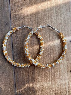 A pair of hoop earrings made with limited edition multicolor silver lined seed beads in creams and caramel colors. Comes in one of five sizes!  30mm (1 inch) 40mm (1.5 inch) 50mm (2 inch) 60mm (2.5 inch) 70mm (3 inch) These one of a kind earrings are fantastic for raves, night clubs, parties, summer vacations, festivals or just for a pop of color in your wardrobe.  Made with a spring clasp for ease. Hypoallergenic professional grade metals, none of the cheap stuff used here! Want another size or Flag Beads, Warm Vanilla Sugar, Cheap Stuff, Boho Hoop Earrings, Night Clubs, Summer Vacations, Silver Line, Vanilla Sugar, Southwest Style