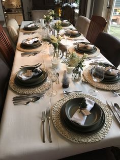 the table is set with place settings for four