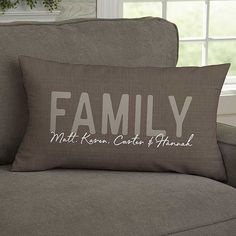 a couch with a pillow that says family on it