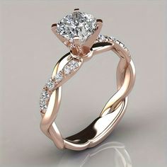 an engagement ring with a twisty band and a princess cut diamond in the center