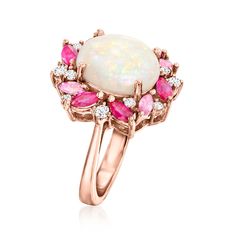 Ross-Simons - Opal, 1.30ct t. w. Multi-Gemstone Ring, .24ct t. w. Diamonds. Size 6. A whimsical work of art! Our stellar ring spotlights a scintillating 12x10mm oval opal cabochon wreathed by lively 1.30 ct. tot. gem wt. marquise rubies and pink sapphires, with .24 ct. t. w. round brilliant-cut diamonds sprinkled throughout. Finely crafted in polished 14kt rose gold. 5/8" wide. Diamond, multi-gemstone and opal ring. Ruby birthstones are the perfect gift for July birthdays. Pink Opal Ring, Multi Gemstone Ring, Ruby Birthstone, Rainbow Opal, Pink Sapphire Ring, Gem Ring, Engagement Rings Opal, Jewelry Accessories Ideas, Ruby Ring