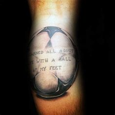 a man's leg with a tattoo on it that reads, i learned all about to fly with a ball at my feet