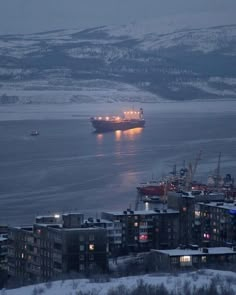 a large cargo ship in the ocean at night