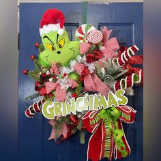 the grinchmas wreath is hanging on the front door