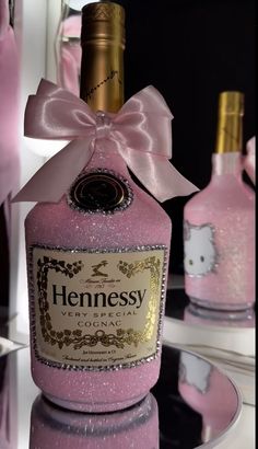 a bottle of hennesy pink ginkage with a bow on the top