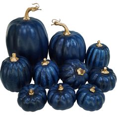 blue painted pumpkins are arranged on a white background, with gold - plated handles