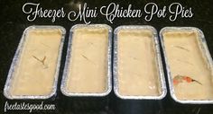 three pans filled with food sitting on top of a counter next to each other