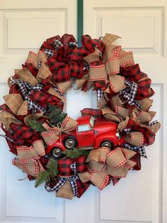 a wreath with a red truck on it