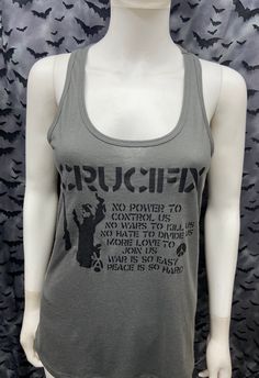 This is a charcoal gray sleeveless long Crucifix tank top with racer back. This has a Crucifix image screen printed on the front. 60% cotton/ 40% polyester These are handmade screenprinted and slightly vary from the photo. Please feel free to email me any questions. Thanks for looking. Due to an influx of incorrect addresses if a package is returned, you must pay the shipping cost to resend the item to you. I do not do exchanges and I do not take returns unless the item is damaged. I thoroughly Anarcho Punk, Long Tank Top, Long Tank Tops, Long Tank, Top Sleeveless, Racer Back, Charcoal Gray, Charcoal Grey, Womens Clothing Tops