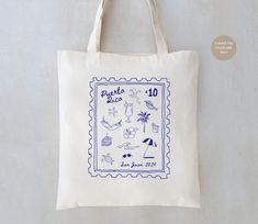 a tote bag with various items on it and the words paris written in blue ink