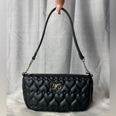 -Super Cute Black Shoulder Bag/Handbag Quilted With Hearts All Over It And Has Heart Rhinestone "Jc" Logo Charm On The Front -Bag Can Be Worn As A Shoulder Bag And As A Handbag -Inside Has One Zippered Wall Pocket With One Sleeve Pocket -All Gold Hardware Accents -New With Tags. No Damages Dimensions: Bag: W:10½" H:6" D:3¾" Luxury Black Heart-shaped Shoulder Bag, Luxury Black Heart-shaped Bag, Chic Black Heart-shaped Shoulder Bag, Chic Black Heart-shaped Bag, Juicy Couture Baby, Juicy Couture Purse, Heart Rhinestone, Couture Handbags, Pink Handbags