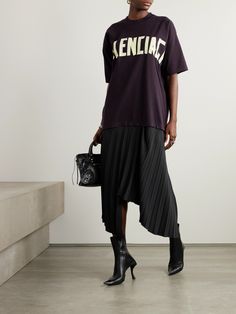 Balenciaga's dress is inspired by the humble streetwear tee. The top half is cut from cotton-jersey and printed with the logo in tape-like font. It's joined with an asymmetric crepe midi skirt, defined by sharp pleats. Balenciaga Dress, Balenciaga Clothing, Black Balenciaga, Crepe Midi Dress, Balenciaga Women, Cotton Midi Skirt, Latest Skirts, Black Midi Skirt, Pleated Midi Skirt