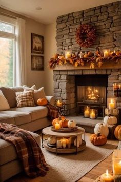 a living room filled with lots of furniture next to a fire place covered in candles