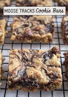 chocolate cookie bars on a cooling rack with the words moose tracks cookie bars above them