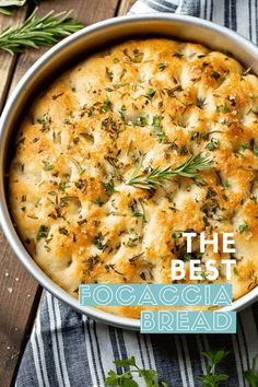 the best focaccia bread recipe is in a pan with herbs on top