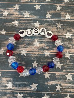 This is a USA beaded bracelet.  It would make a great addition to a girl's 4th of July outfit. It would make a cute gift for a girl. It has two black and white heart beads. It has USA letter beads. It has red, white, and blue faceted 8mm beads. It was made with . 8mm sturdy stretch string. I tie it several times to prevent breakage. It fits girls ages 4-7. It stretches to fit on the wrist. All items are ready to be shipped I do combined shipping. Items ship in 2-5 business days.  Check out more Usa Bracelet, 4th Of July Gifts, Gifts Bracelets, Patriotic Bracelet, Bracelets For Girls, 4th Of July Outfit, Black And White Heart, 4th Of July Outfits, Letter Beads