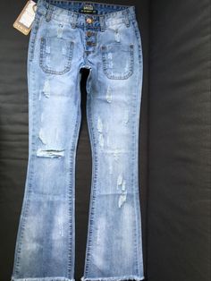 These button-up wide leg jeans featuring destroyed denim and ripped knees are both comfy and stylish. Made with a cotton and denim blend; these are perfect for your casual outfit paired with sandals or pair with heels for a night on the town. Business Casual Womens Fashion, Fashion Boyfriend, High Waist Mom Jeans, Denim Wide Leg, Palazzo Trousers, Destroyed Denim, Fashion Tips For Women, Womens Fashion For Work, Autumn Fashion Women