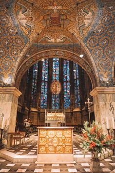 the interior of a church with stained glass windows