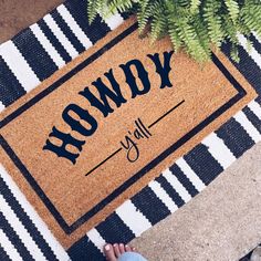 someone is standing in front of a door mat with the words row y on it