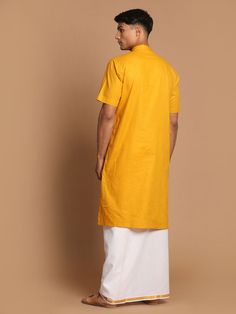 VASTRAMAY Men's Mustard Cotton Kurta And Mundu Set Add a touch of tradition to your wardrobe with this mustard cotton kurta and mundu set from VASTRAMAY. Perfect for special occasions or festive events, this set offers comfort and style. The kurta features a classic design with intricate detailing, while the mundu adds an elegant touch. Made from high-quality cotton, this set is easy to maintain and durable, ensuring long-lasting wear. Features: Mustard cotton kurta with intricate detailing Come Traditional Short Sleeve Festive Kurta, Yellow Short Sleeve Festive Set, Cotton Sherwani With Dabka Detailing For Puja, Cotton Sherwani With Dabka For Puja, Yellow Cotton Sets With Traditional Drape, Yellow Cotton Kurta With Dabka Detail, Yellow Cotton Kurta With Dabka, Yellow Cotton Kurta With Dabka Embroidery, Unstitched Cotton Kurta For Diwali