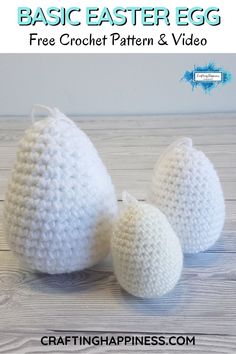 two crocheted eggs sitting on top of a wooden table next to each other