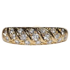 a gold ring with diamonds on it