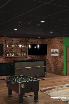 an image of a game room with foo - o - mat table and bar in the background