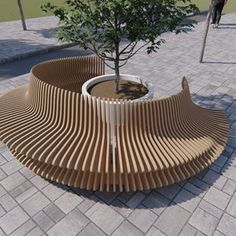 a wooden bench sitting on top of a brick walkway next to a tree and water fountain