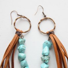 Leather Fringe Earrings with Turquoise Chunks Crafted with love and care, these earrings boast a delightful blend of turquoise beads and genuine leather. The result? A mesmerizing, eye-catching boho look that's bound to turn heads and steal the show!These Leather Fringe Earrings with Turquoise Chunks are the perfect length at approximately 5 inches, striking just the right balance between bold and elegant. They're the ideal statement piece to add that extra oomph to your outfit, whether you're dressing up for a night out or simply expressing your unique boho spirit.Each pair is handmade with a touch of boho magic, making them as unique as you are. So, why settle for ordinary when you can flaunt extraordinary? Elevate your style quotient with our Leather Fringe Earrings and embrace the boho Bohemian Turquoise Leather Earrings, Bohemian Leather Dangle Earrings, Bohemian Leather Dangle Jewelry, Blue Bohemian Leather Earrings, Blue Leather Bohemian Earrings, Bohemian Blue Leather Earrings, Bohemian Beaded Leather Jewelry, Bohemian Leather Earrings, Candle Stamping