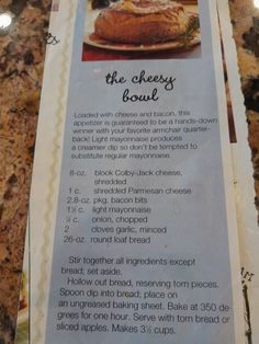 a menu for the cheesy flour is displayed on a counter top with other food items