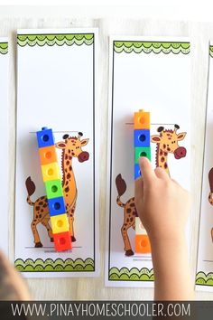 a child is playing with legos and building blocks in the shape of a giraffe