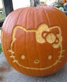 a hello kitty pumpkin carved to look like it is smiling