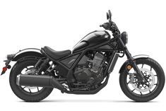 a black motorcycle is shown on a white background