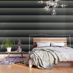 a bedroom with black and white striped walls