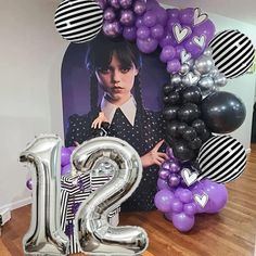 the number twenty two is displayed in front of balloons and an image of her on it