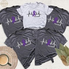 Memories Matter Alzheimer's Custom Shirt, Purple Ribbon Awareness Team Tshirt, Memories Matter Group Shirts, I Will Remember For You Outfit. Designed to raise awareness of Alzheimer's disease and support those living with the disease. These t-shirts usually aim to raise awareness and provide social support in the fight against the disease. They usually have slogans such as "Memories Matter" or symbols related to Alzheimer's. These types of products are used to both boost the morale of those stru Purple T-shirt For Awareness Events With Letter Print, Purple T-shirt With Letter Print For Awareness Events, Crew Neck Top With Graphic Print For Awareness Events, Graphic Print Crew Neck Top For Awareness Events, Purple Casual Top For Awareness Events, Casual Purple Top For Awareness Events, Purple Ribbon Awareness, Team Tshirt, Awareness Tshirts