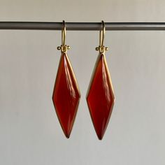 Rich vermillion color balances elegance with extravagance in these strikingly structured carnelians. 18k yellow gold Carnelian, 31.8ctw, 11mm x 38mm (7/16" x 1 1/2")Earrings hang 2 1/16" from the ear Each earring weighs 5.3g Modern Carnelian Jewelry With Polished Finish, Modern Red Carnelian Jewelry, Formal Red Carnelian Jewelry, Modern Carnelian Jewelry For Formal Occasions, Formal Yellow Gold Chalcedony Jewelry, Luxury Carnelian Jewelry For Formal Occasions, Elegant Carnelian Dangle Earrings, Elegant Carnelian Jewelry For Formal Occasions, Gold Carnelian Gemstone Earrings