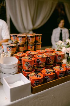 an assortment of yogurts on display at a wedding