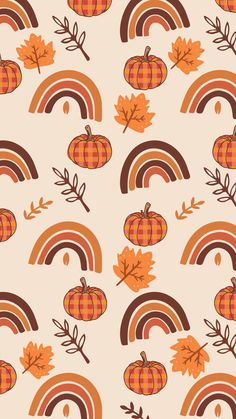 a pattern with pumpkins, leaves and a rainbow in the background that says happy fall