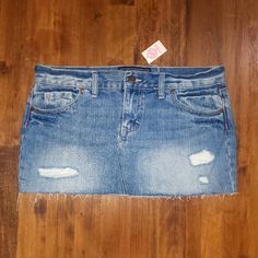 -Brand: Pink Victoria’s Secret -Type: Distressed Cut Off Denim Jean Skirt -Color: Medium Blue Wash -Size: Women’s 2 -Waist Measurement: 15 1/2” -100% Cotton -Comes From A Smoke Free Home. -Condition: New With Tags Please Check Out The Other Pink And Victoria’s Secret Items I Have For Sale. Fitted Distressed Medium Wash Mini Skirt, Distressed Dark Wash Mini Skirt, Dark Wash Distressed Mini Skirt, Distressed Medium Wash Mini Skirt, Ripped Medium Wash Mini Skirt, High Rise Ripped Mini Skirt In Medium Wash, Distressed Denim Mid-rise Mini Skirt, Mid-rise Distressed Denim Mini Skirt, Ripped Cutoff Medium Wash Mini Skirt