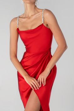 Our ‘Juliet’ midi dress is cut from the softest silk Satin for that perfect drape in a romantic Wine Red hue. It features a glamorous handmade rhinestone crystal Straps. ‘Juliet ' is super comfortable to wear and the bodice features our incredible corsetry boning for a super cinched fit to accentuate your waist and is beautifully draped at the low baring neckline, held by dainty rouleau shoulder straps.The skirt is slightly gathered to really flatter your figure and pleated to delicately drape a Glamorous Draped Midi Dress For Cocktail, Elegant Draped Mini Dress For Prom, Elegant Draped Midi Dress For Prom, Glamorous Silk Midi Dress For Prom, Glamorous Silk Midi Dress, Elegant Red Draped Dress, Elegant Draped Red Evening Dress, Glamorous Satin Dress With Rhinestones, Elegant Red Draped Evening Dress