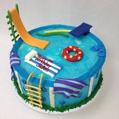 a birthday cake decorated with an image of a pool, life preserver and beach chair