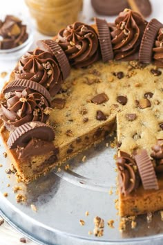 a chocolate chip cookie cake with one slice cut out and the rest on top of it