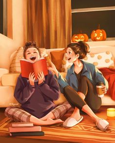 two people are sitting on the floor reading books and drinking coffee while one person is holding a book