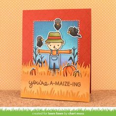 a handmade card with an image of a boy in a hat and scarecrows