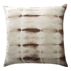 a white and brown pillow on a white background