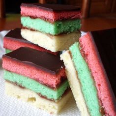 four different colored desserts stacked on top of each other