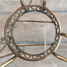 a circular metal object sitting on top of a wooden floor