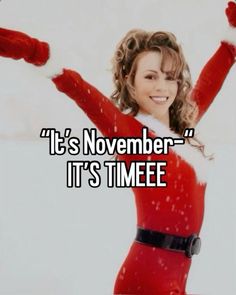 a woman dressed as santa clause holding her arms up in the air with text that reads, it's november it's time